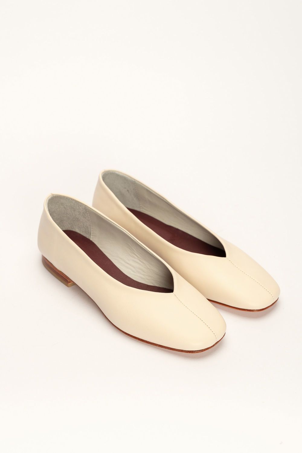 Black leather high shoe-vamp flats with gold and iron studs
